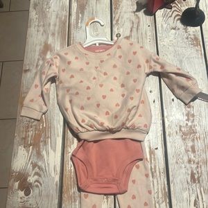 A three pieces with leggings a bodysuit and a sweater